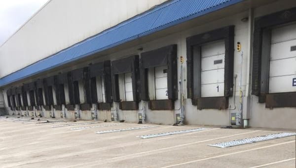 Loading docks at SYSCO facility in Pittsburgh secured with POWERCHOCK vehicle restraints