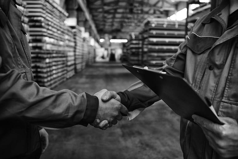 Hand shake in logistics warehouse